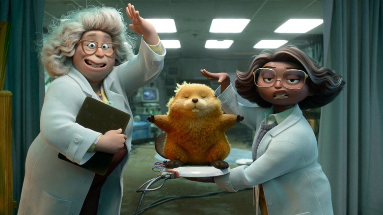 Scientists demonstrating how "hopping" technology works in Hoppers (2026)