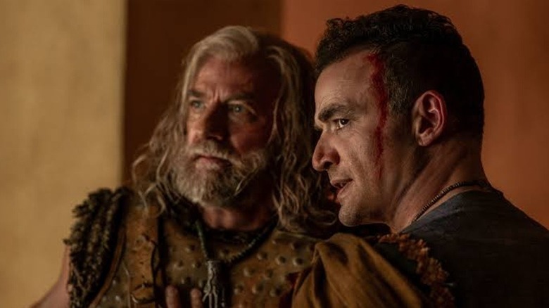 Ashur whispering to Korris in "Spartacus: House of Ashur" (2025)