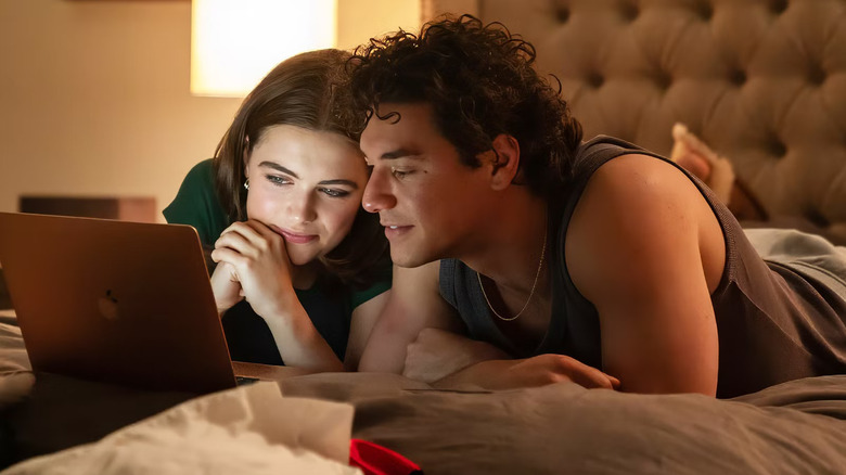 Hannah and Garrett watching a video together on Off Campus