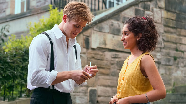 Dex writing his number down for Emma in One Day