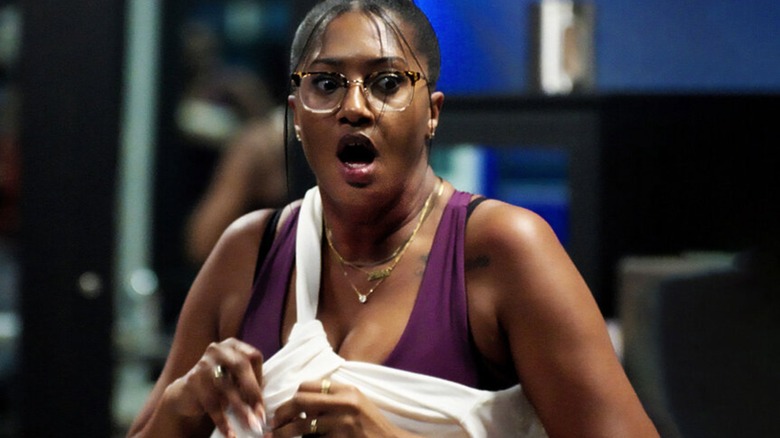 A contestant opens her mouth in fear on Scare Tactics