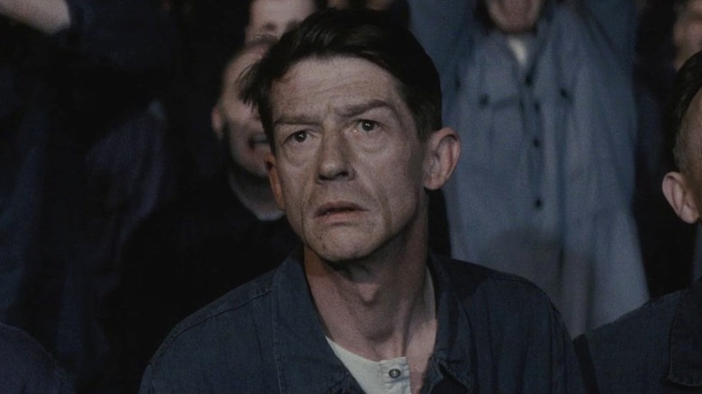 Winston looking concerned at a rally in "1984" (1984)