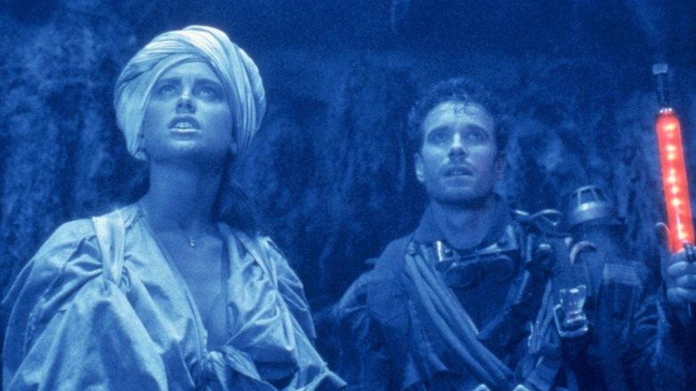 Wanda and Gus in a blue cave in "Alien from L.A." (1988)