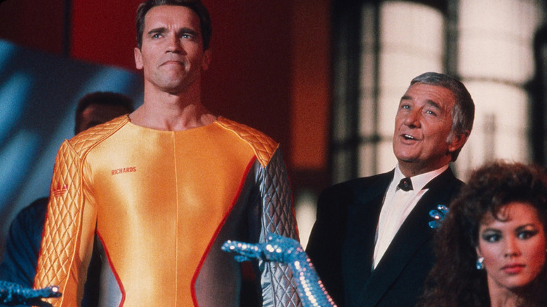 Ben Richards being presented on stage by Damon Killian in "The Running Man" (1987)