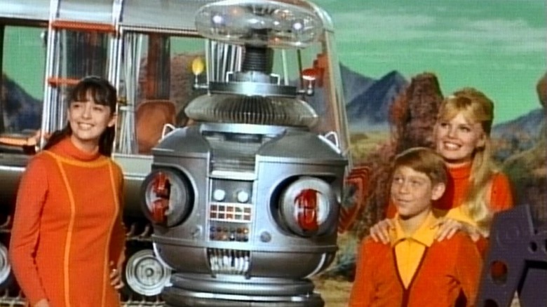 Penny, The Robot, Will, and Judy in Lost in Space (1965)