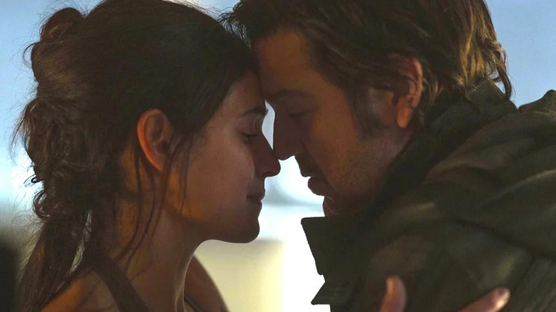 Cassian Andor and Bix Caleen leaning into each other tenderly in "Andor" Season 2 (2022-2025)