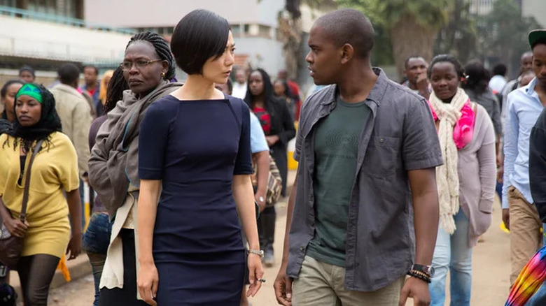 Sun Bak and Capheus Onyango staring at each other on a Nairobi street in "Sense8" (2015-2018)