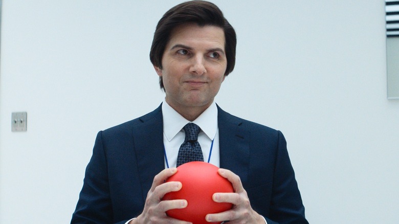 Mark S smiling while holding a ball in 