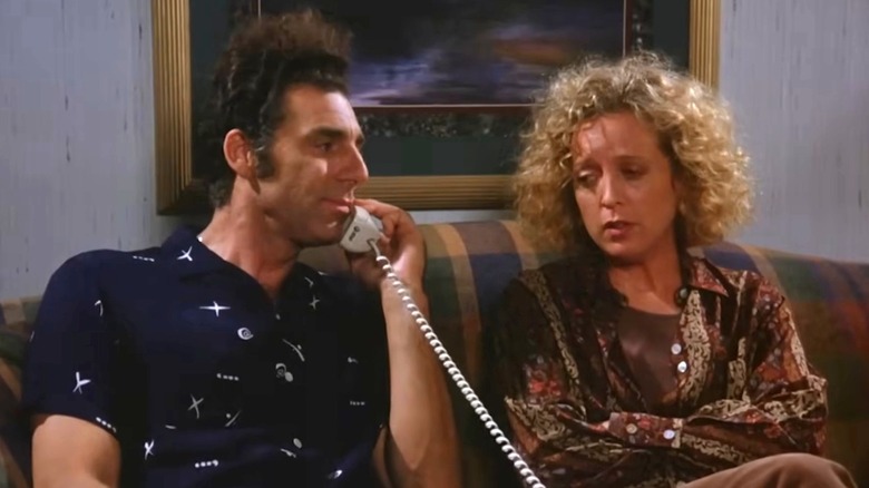 Kramer on the phone next to upset Noreen