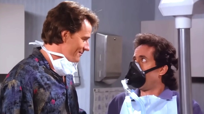 Tim Whatley and and Jerry Seinfeld looking at each other