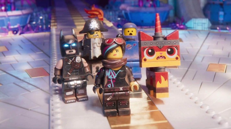 Wyldstyle and her crew encountering an alien being in "The Lego Movie 2: The Second Part"