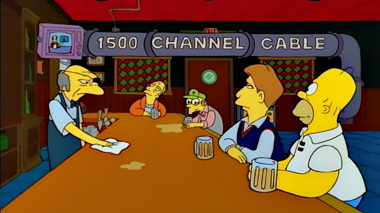 Homer and Hugh watching TV at Moe's on "The Simpsons"