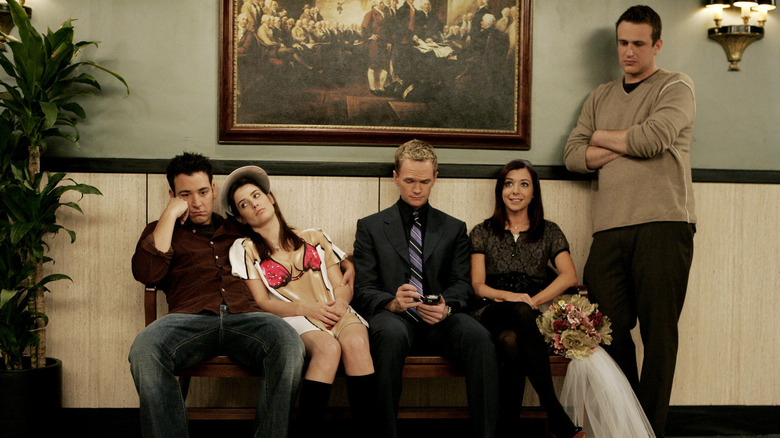 Ted, Robin, Barney, Lily, and Marshall sitting in a row, waiting to initiate Lily and Marshall's Atlantic City wedding