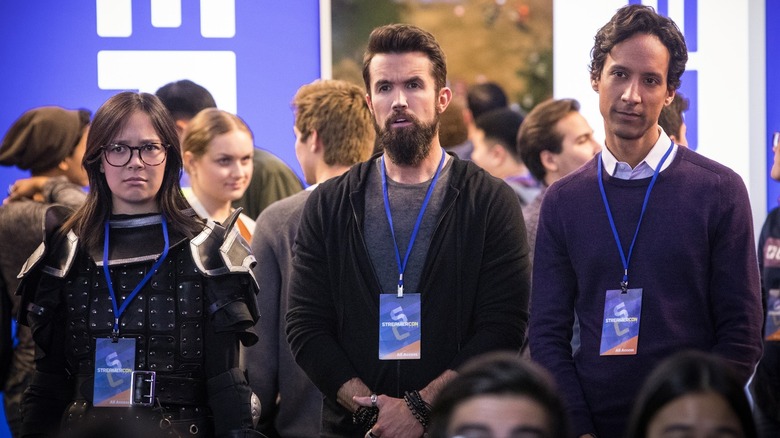 Poppy (dressed in cosplay), Ian, and Brad standing together in attendance at games conference