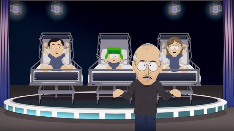 Steve Jobs in front of three people chained to beds on "South Park"