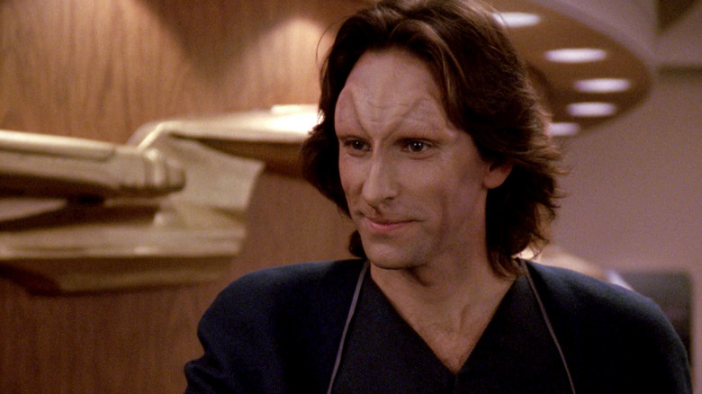 Odan smiles politely in Star Trek: The Next Generation