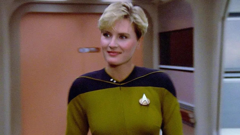 Yar smiles in the corridor in Star Trek: The Next Generation