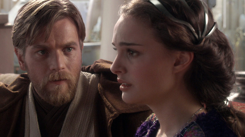 Padmé looking deeply distraught as Obi-Wan looks on worriedly in an apartment on Coruscant in Star Wars: Revenge of the Sith