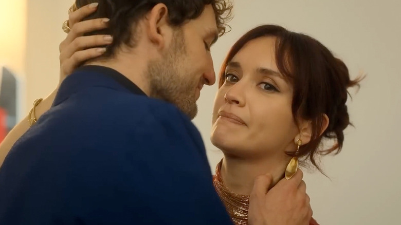 Cherry looks off to the side as she embraces Daniel in The Girlfriend