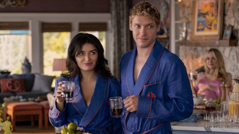 Amelia and Benji in robes as Abby looks on in The Perfect Couple