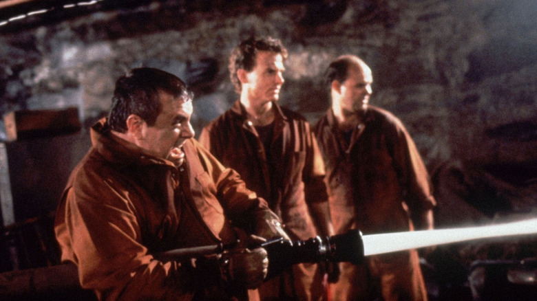 John, Brogan, and Ippeston spraying a hose in "Graveyard Shift"