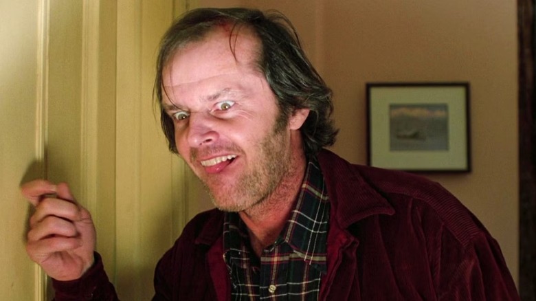 Jack Torrance knocking on a door in "The Shining"