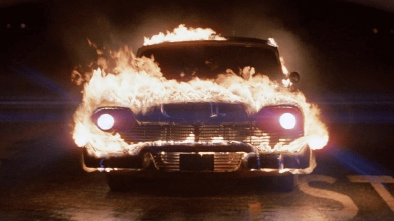 Christine drives while on fire in "Christine" (1983)