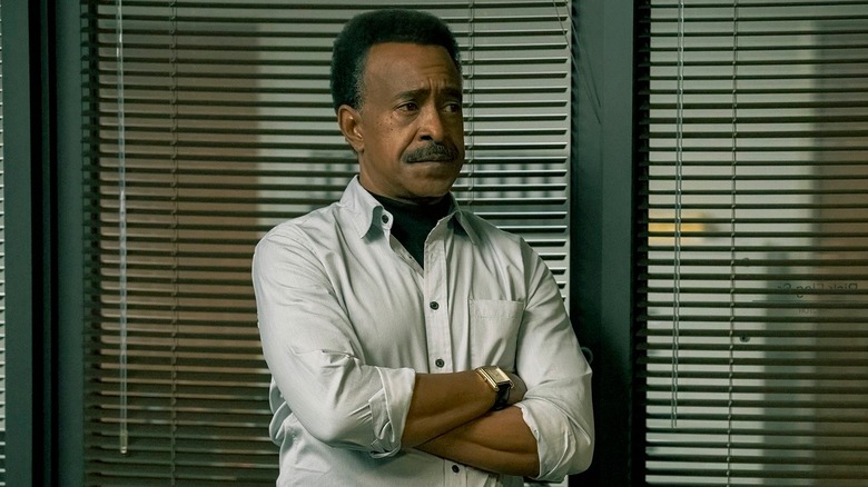 Langston Fleury crossing his arms in Peacemaker Season 2