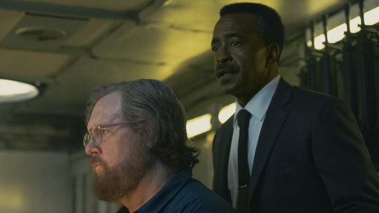 Langston Fleury overseeing John Economos in Peacemaker Season 2