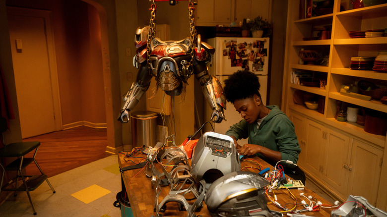 Riri Williams works on her iron suit in "Ironheart" (2025)