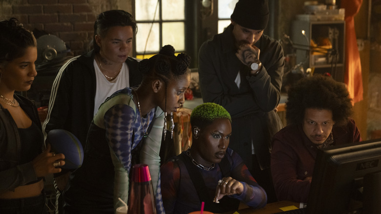 Roz, Jeri, Clown, Slug, John, and Rampage standing around computer in 