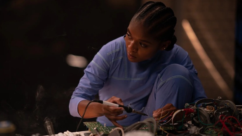 Riri Williams tinkering away in "Ironheart" (2025)
