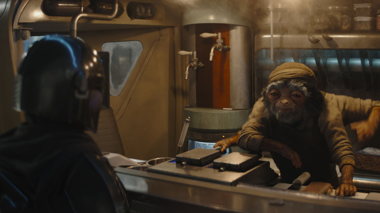 Din Djarin talking to a fry cook in The Mandalorian and Grogu