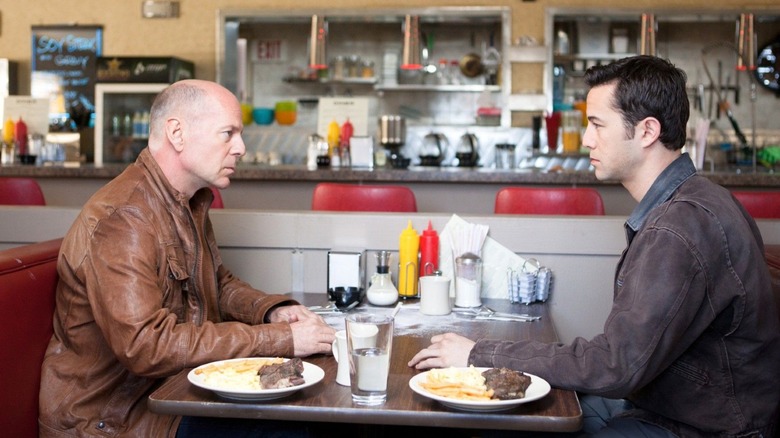 Joe and Old Joe sitting together at a diner in 'Looper'