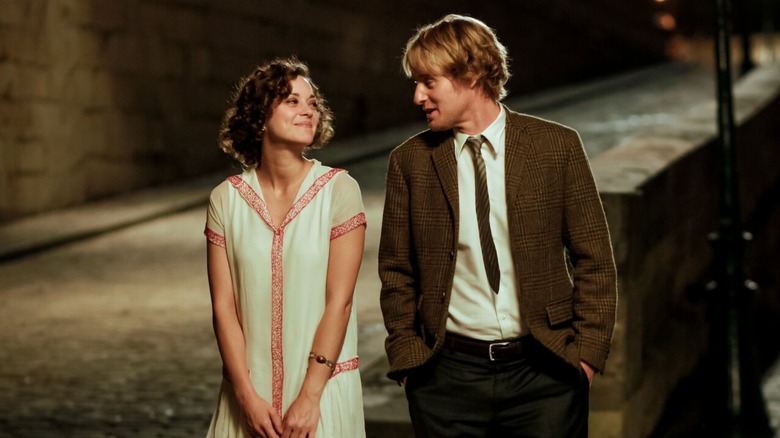 Gil Pender and Adriana walking by The Seine in 'Midnight in Paris'