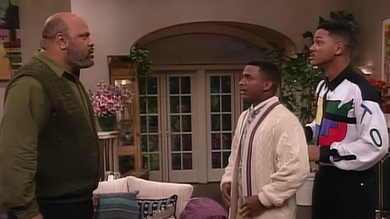 Uncle Phil Banks standing and staring furiously at Carlton Banks and Will Smith on "The Fresh Prince of Bel-Air" (1990-1996)
