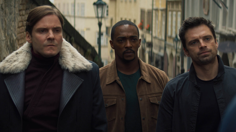 Zemo, Sam Wilson, and Bucky standing together in 