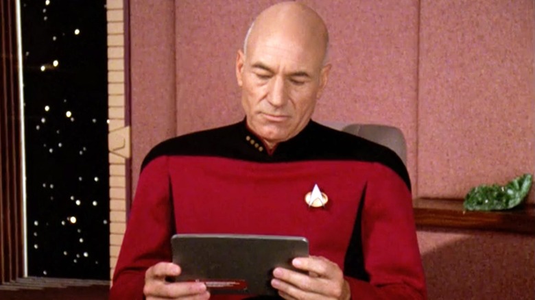 Captain Picard using a PADD in 