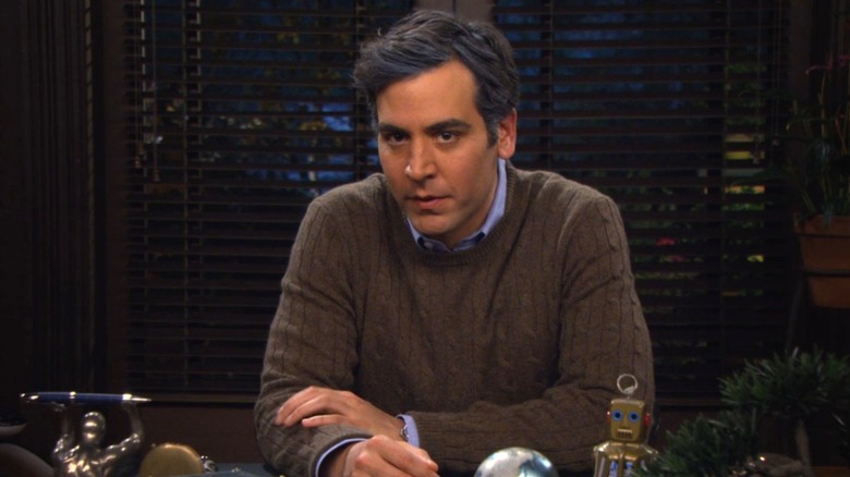 Ted sitting at a desk in "How I Met Your Mother."