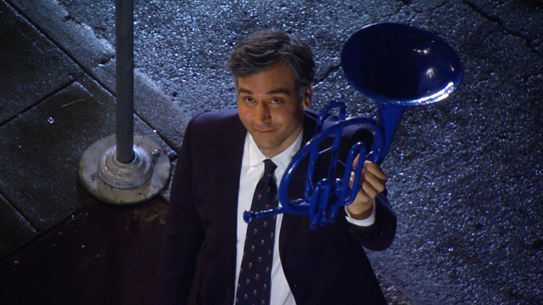Ted holding a blue French horn in "How I Met Your Mother."
