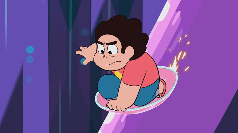 Steven slides on a shield down a purple railing in 