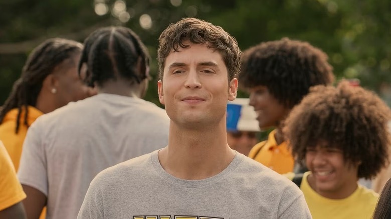 Benny looking uncomfortable in a crowd of students in "Overcompensating"