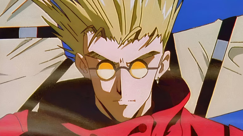 Vash the Stampede wearing glasses and a red coat in Trigun (1998)