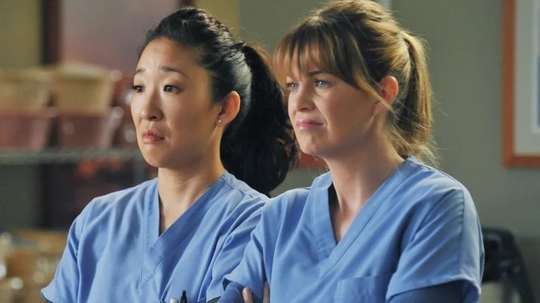 Meredith and Cristina looking annoyed on Grey's Anatomy