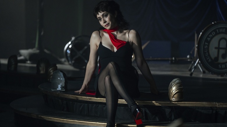 Sofia in a black outfit smirking on The Penguin