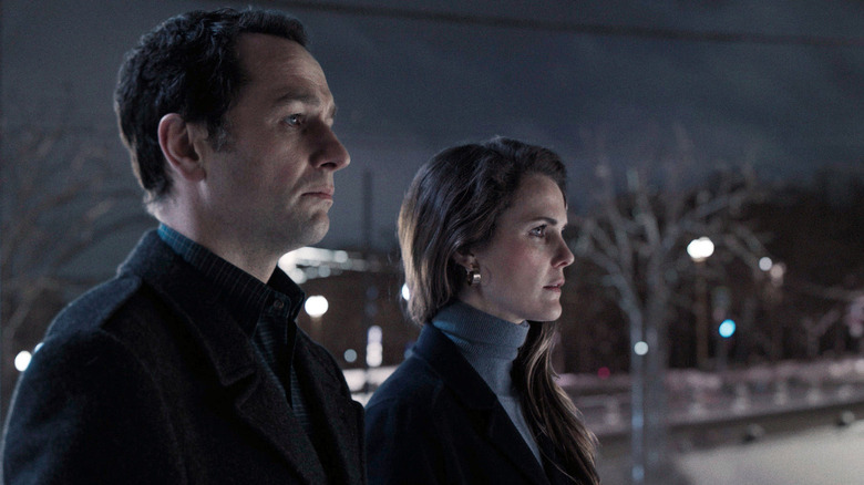 Mischa and Nadezhda standing side by side outside in The Americans (2013)