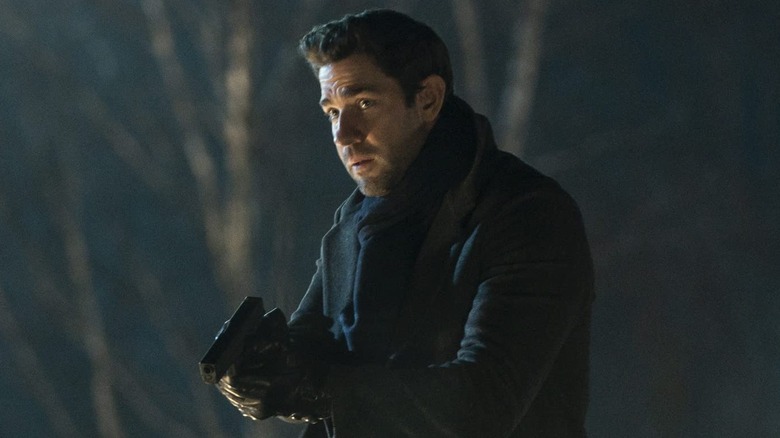 Jack holding a gun outside at night in Tom Clancy's Jack Ryan (2018)
