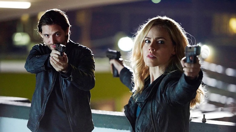 Cassie and Cole aiming guns in 12 Monkeys (2015-2018)