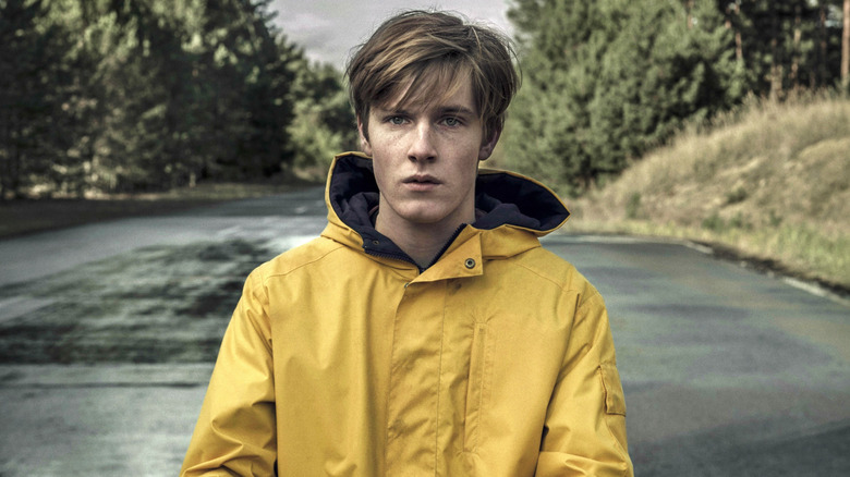 Jonas Kahnwald standing in the middle of a road in Dark (2017-2020)