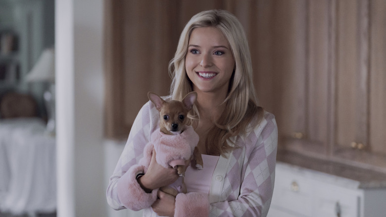 Elle holding a puppy on Elle